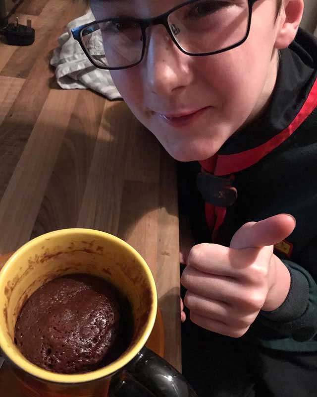 cubs boy with cake in a cup