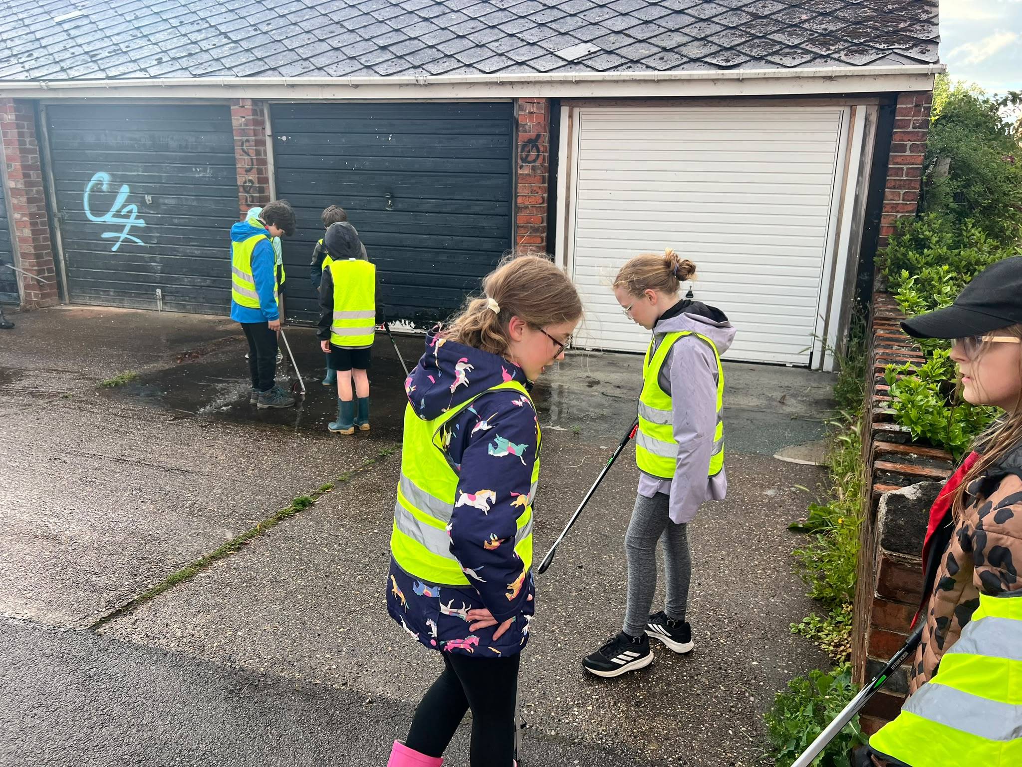 The Cub Pack hard at work with their litter pickers